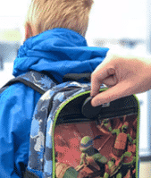 personal tracker placed in the backpack of a kid